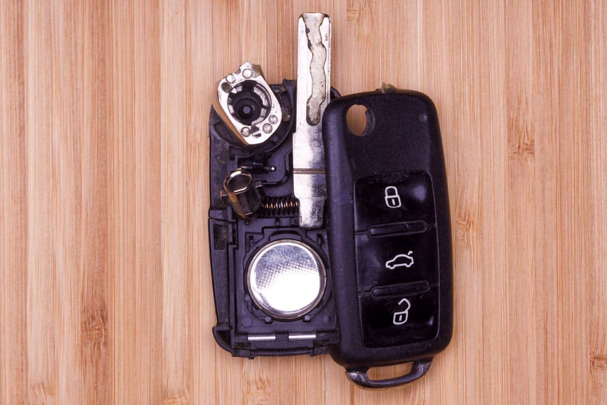 Damaged remote key fob on wooden table