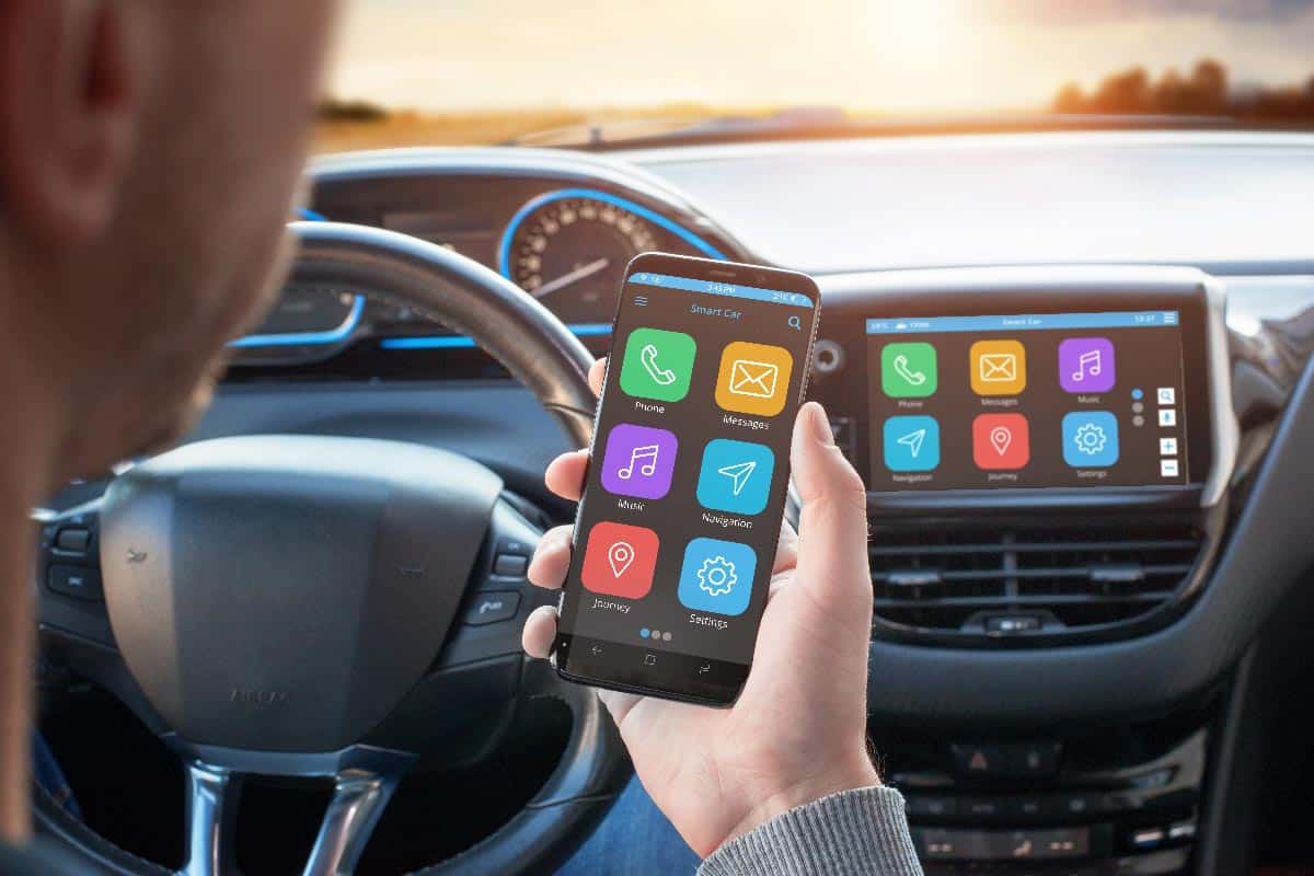 Driver uses a mobile phone with smart driving assistance apps