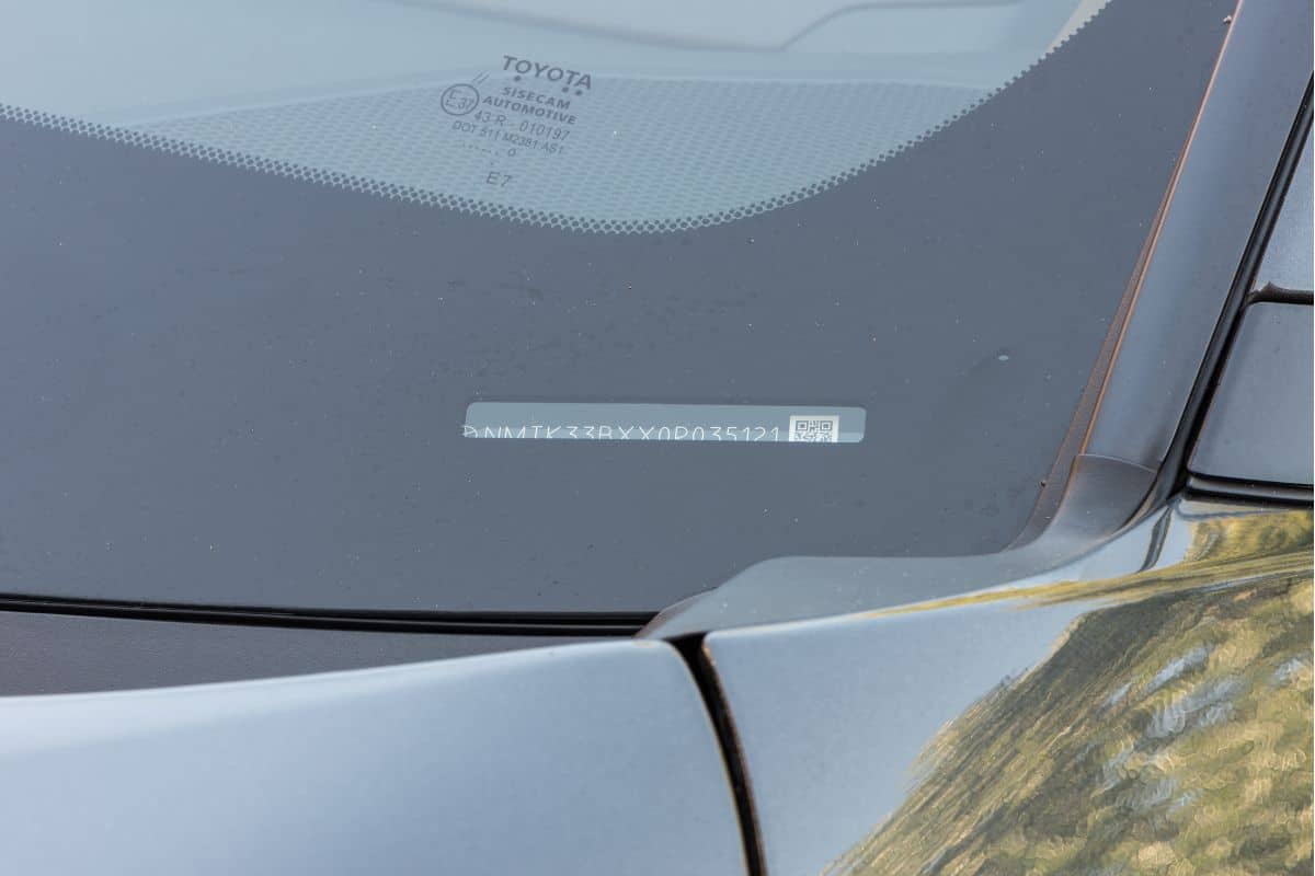 A Vehicle identification number on glass windscreen of a modern car
