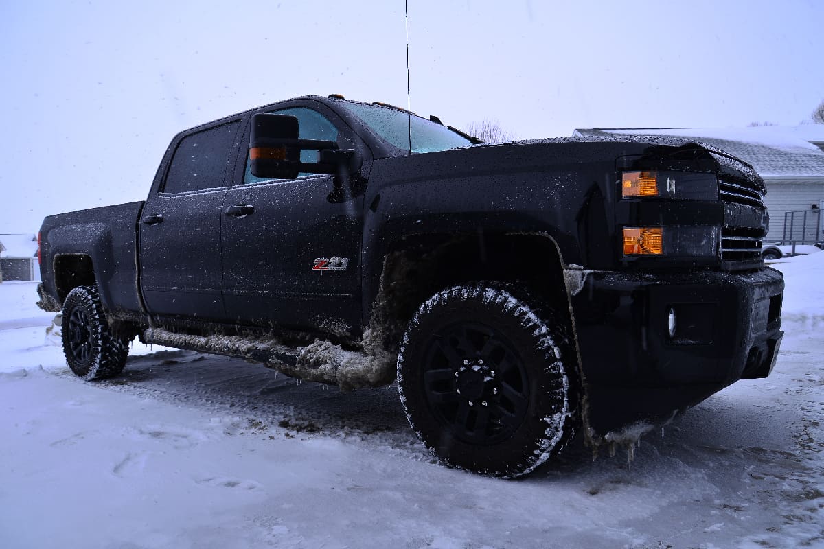 Chevrolet Silverado  after a long winter drive on a very stormy day