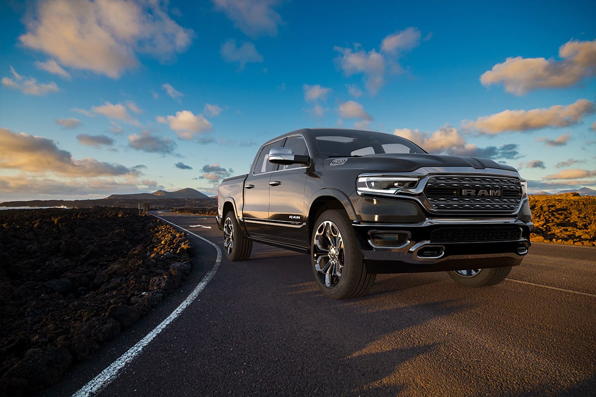 Dodge RAM 1500 on the road leading through the volcanic landscape