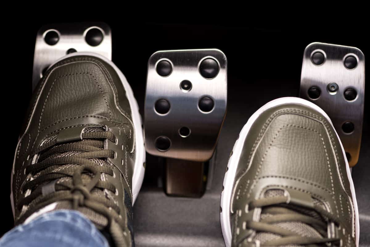 Man stepping on clutch pedal