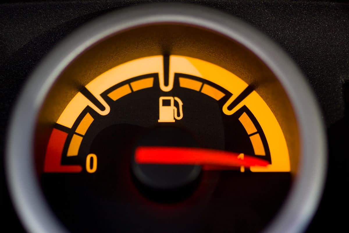 close up photo of a fuel indicator, arrow pointed on full tank sign