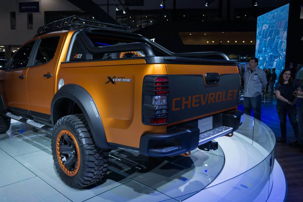 An matte orange Chevrolet Colorado Xtreme displayed on a turntable inside Chevrolet pavilion at 2016 Sao Paulo International Motor Show.