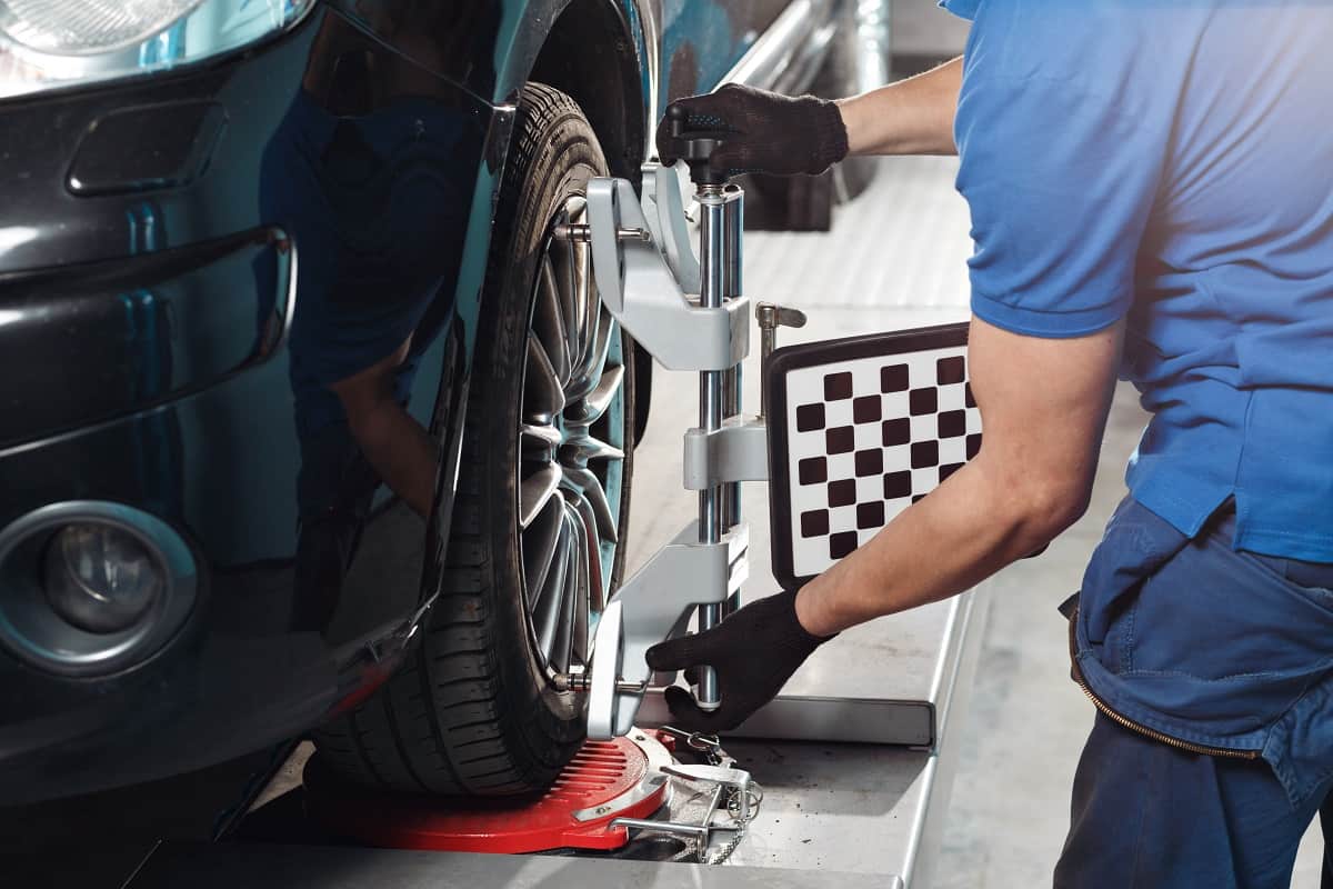 Bad Wheel alignment - Grid sensor sets mechanic on auto. Car stand with sensors wheels for alignment