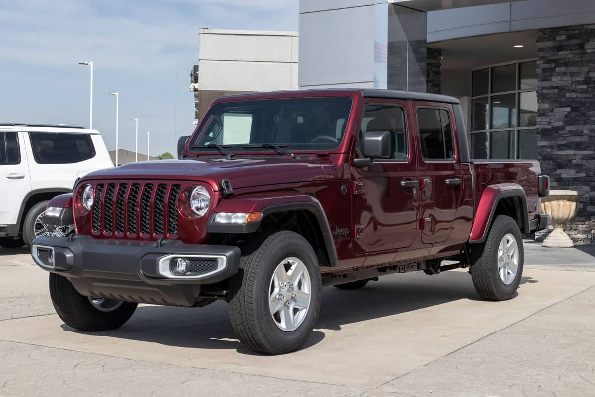 Jeep Gladiator display at a Stellantis dealer. The Jeep Gladiator models include the Sport