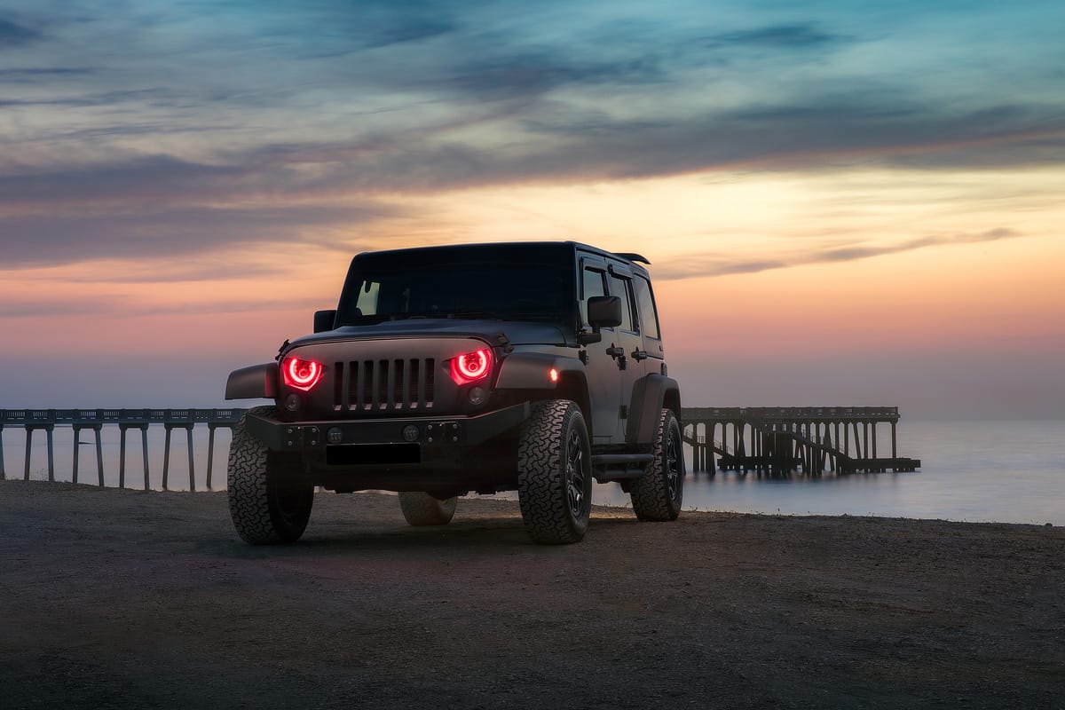 Red eyeliner headlights of a Jeep Gladiator