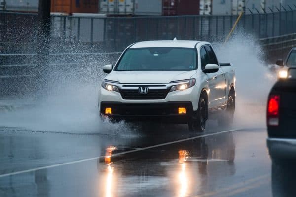 The driver of a Honda Ridgeline navigates a flooded portion of the Bedford Highway after heavy rains, Honda Ridgeline Backup Camera Not Working - Why And What To Do?