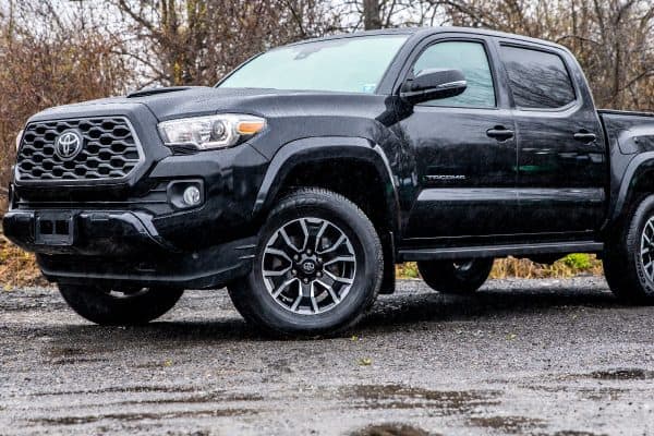 A toyota tacoma truck parked on the street, How To Remove Center Cap Toyota Tacoma