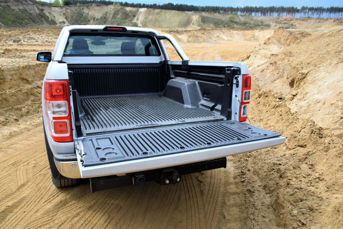 pick up truck cargo bed open on the middle of the desert