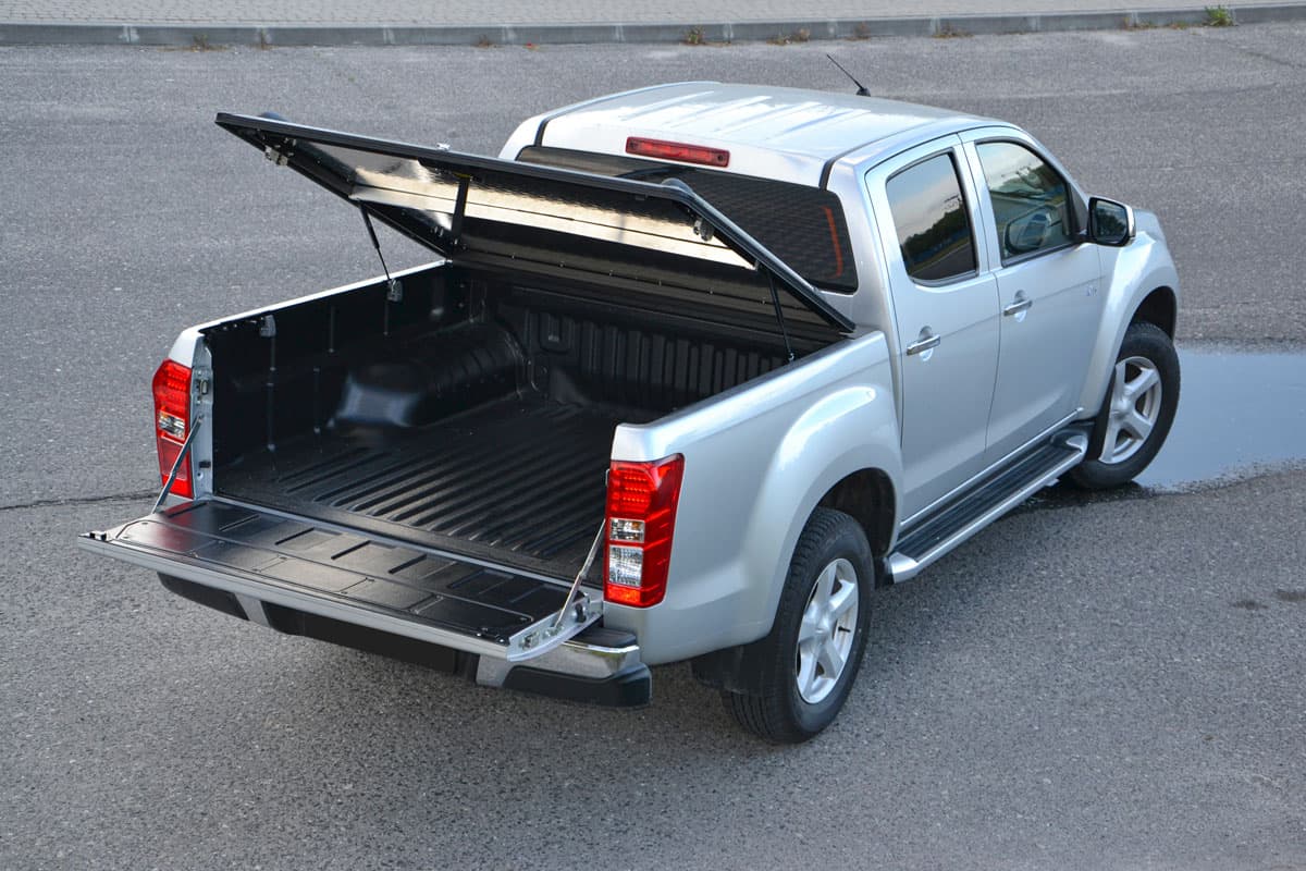 silver pick up on the car parking lot showing cargo bed