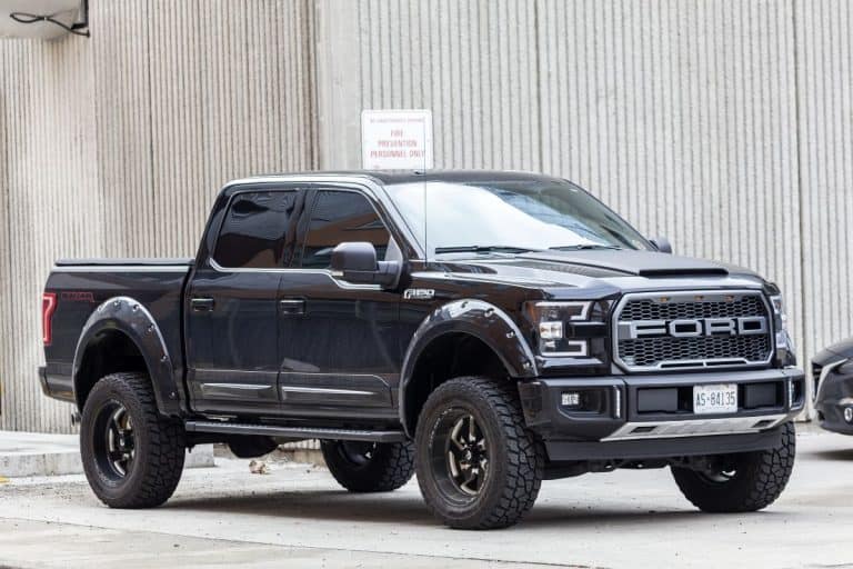 Black Ford F 150 SVT Raptor Dakar Edition on a parking lot in the city of Toronto. - Installing Ford F-150 Towing Mirrors - How To