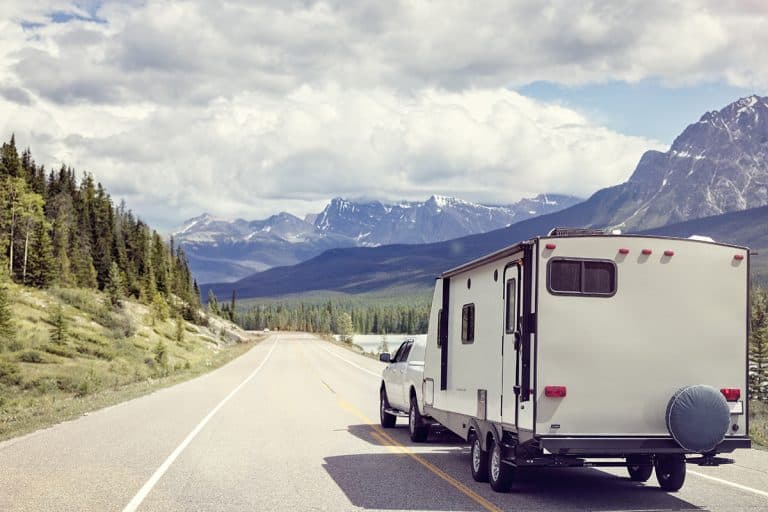 Caravan or recreational vehicle motor home trailer on a mountain road, Which Trucks Are Best For Towing?