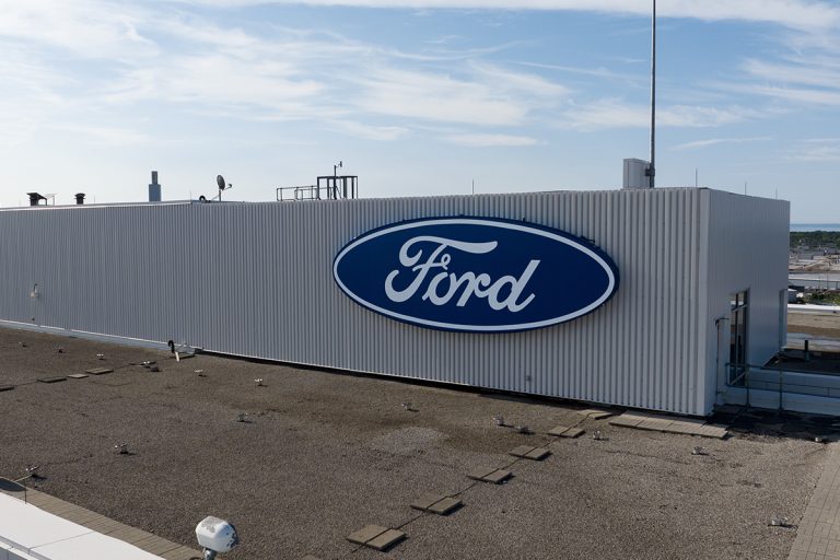 A Ford Motor Company logo is seen atop of their headquarters office building at near their assembly plant, Are Ford F-150s Made In The USA?