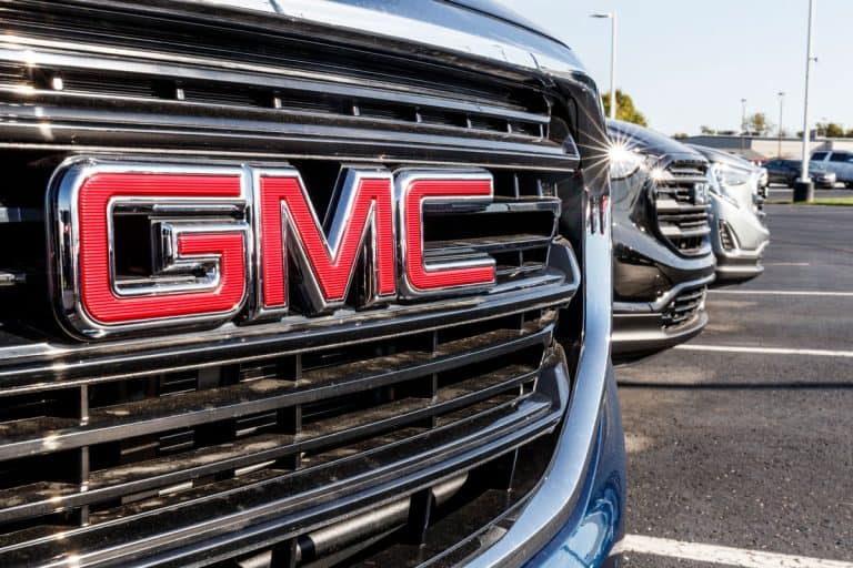 GMC SUV display at a Buick GMC dealership. GMC focuses on upscale trucks and utility vehicles and is a division of GM, What Are The Different Models Of GMC Trucks?