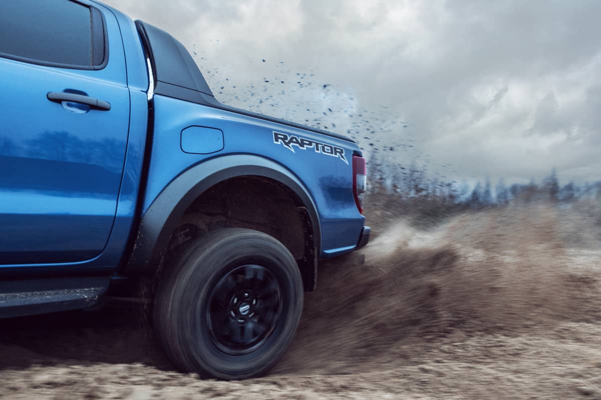 Munich Germany 1 February 2020 Ford Ranger Raptor T6 mid-size pickup truck drifting on sand and dirt.