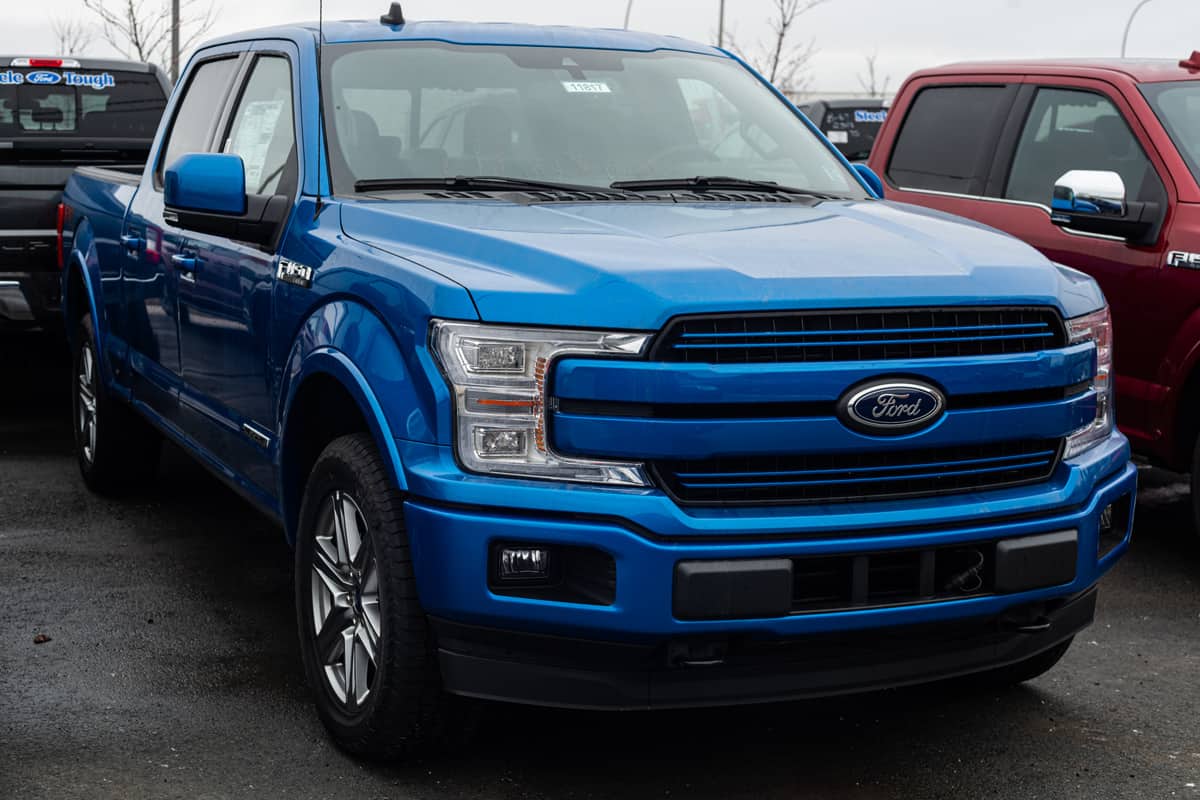Blue Ford F150 at a dealership