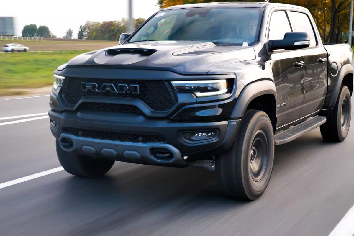 Dodge Ram TRX drives on a country road. Ram TRX is the most powerful series-production pick-up. Its 6,2-liter Supercharged V8 delivers 702 hp.