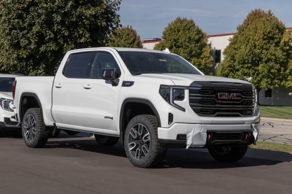 GMC Sierra 1500 pickup display at a dealership. GMC offers the Sierra in HD, HD Pro, AT4 and Denali models, What Is The Towing Capacity Of GMC Sierra