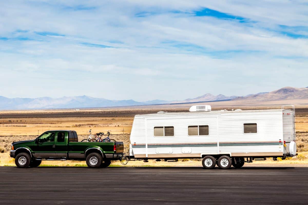pick up truck with RV travel trailer on the road
